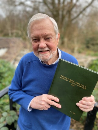 Image shows Tecnon OrbiChem founder and senior advisor Charles Fryer with his copy of the report that launched the firm into fibres and intermediates business intelligence