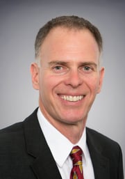 A headshot photograph of Tecnon Orbichem lead business manager William Bann.