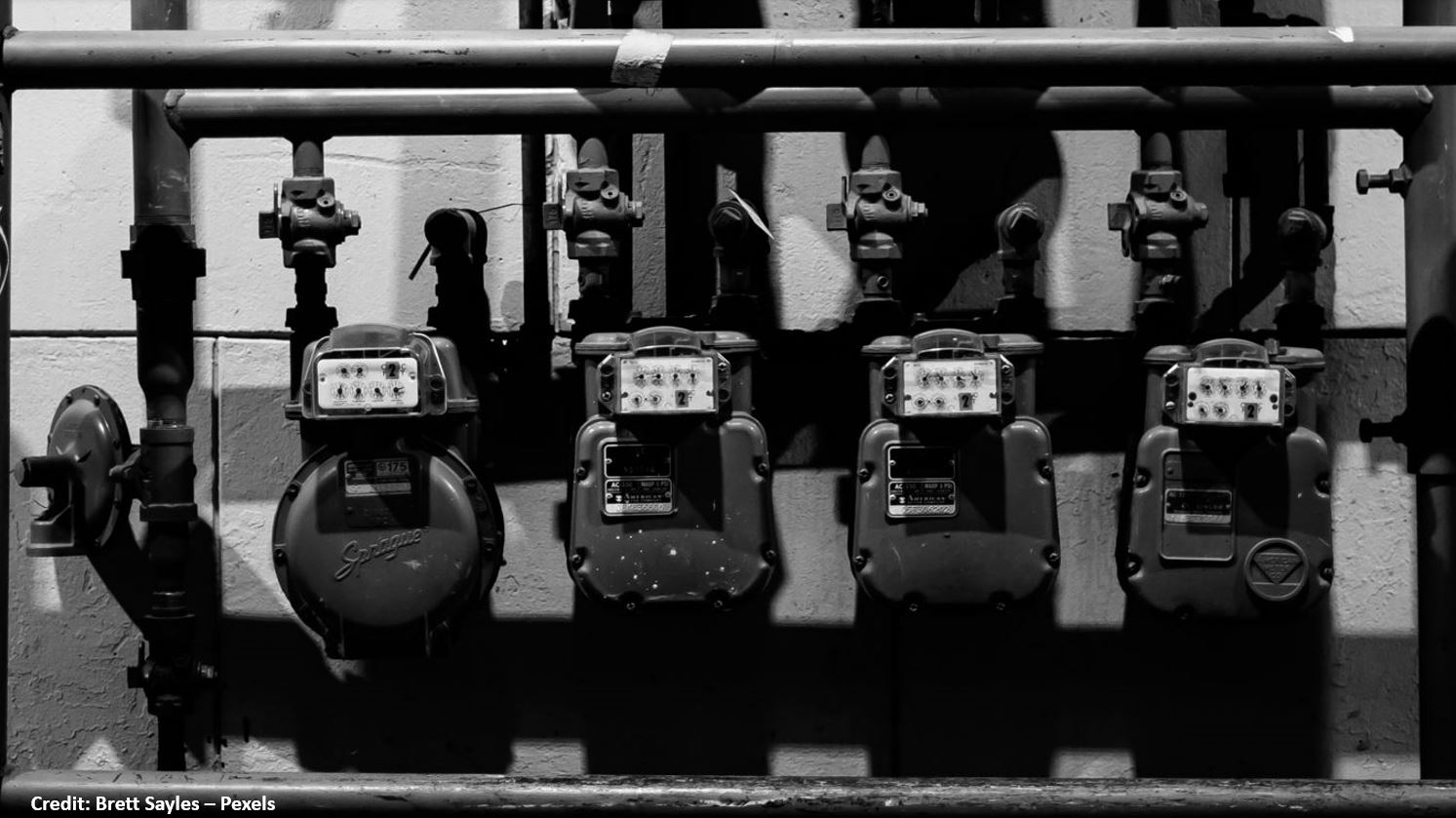 A black and white photograph of old gas readers