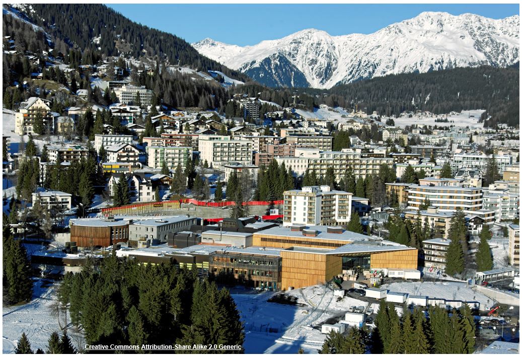 The skyline and metropol of the town of Davos located in the Swiss Alps covered in snow.